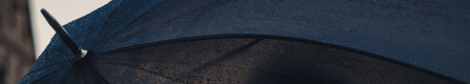 close up of man holding umbrella